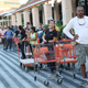 Eduardo Soriano of Miami, in front, started waiting in this line at dawn to purchase plywood sheets at a Home Depot store in North Miami, Fla., on Sept. 6, 2017. (Marta Lavandier/AP Images)